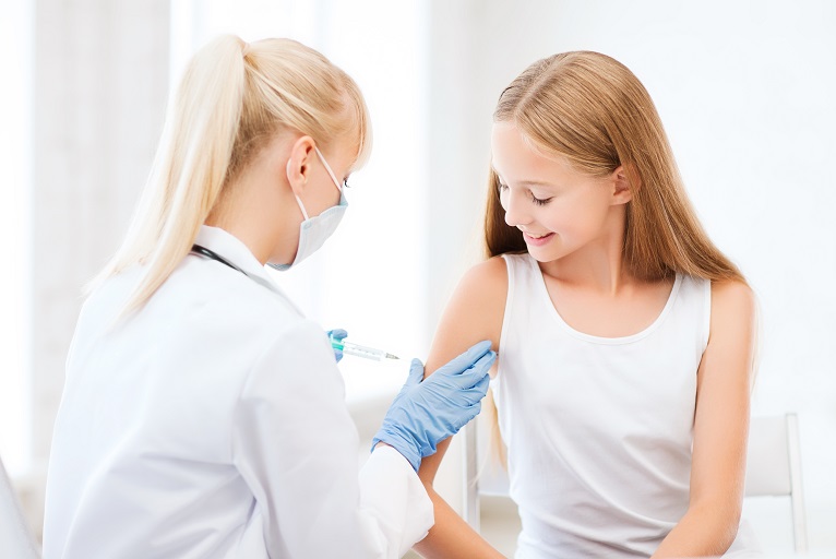 doctor doing vaccine to child in hospital