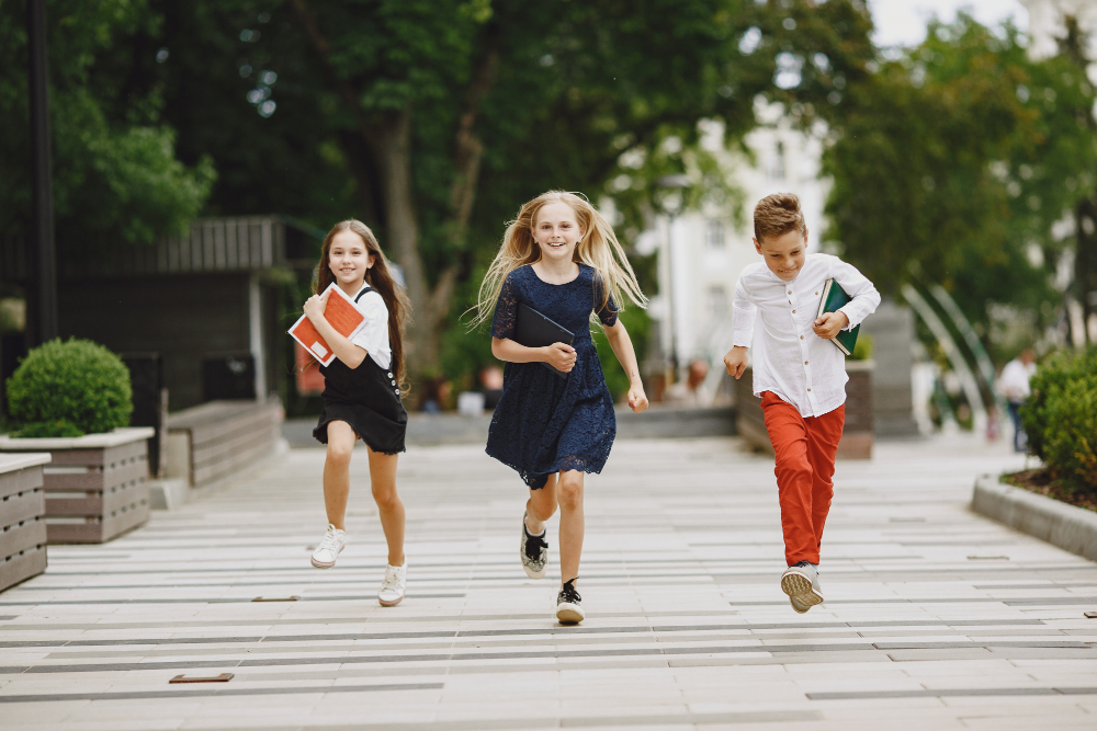 students running with books