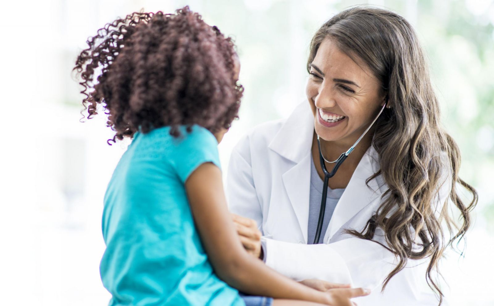 Doctor with adolescent
