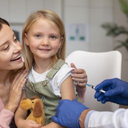 young-mother-with-her-daughter-pediatrician- influenza vaccine